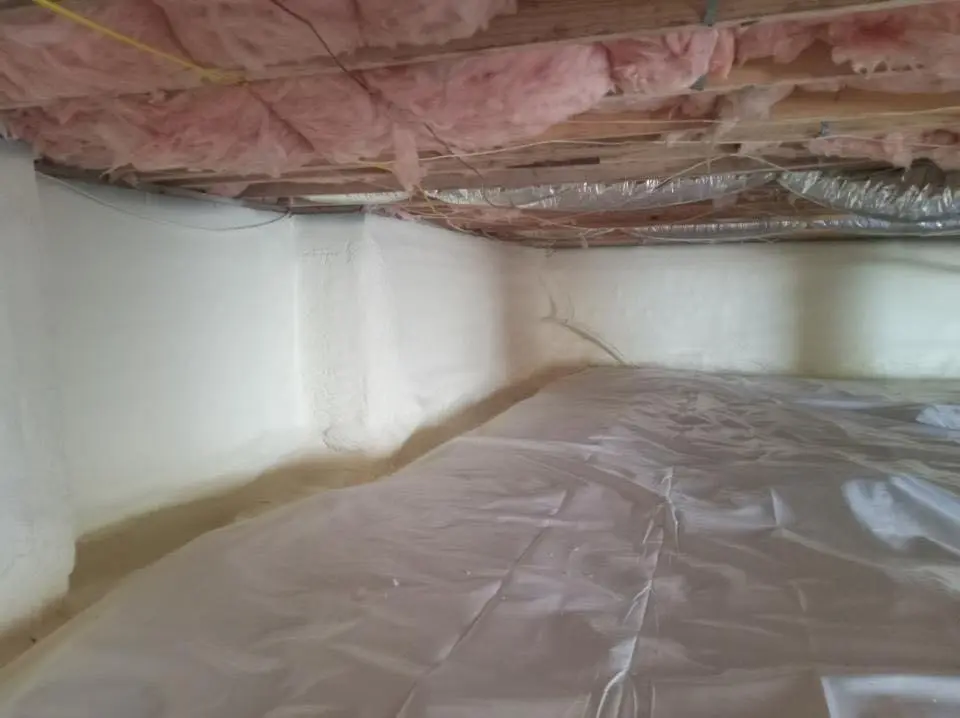 Crawl space encapsulation with closed-cell spray foam for Commercial Roof Restoration in Emporia
